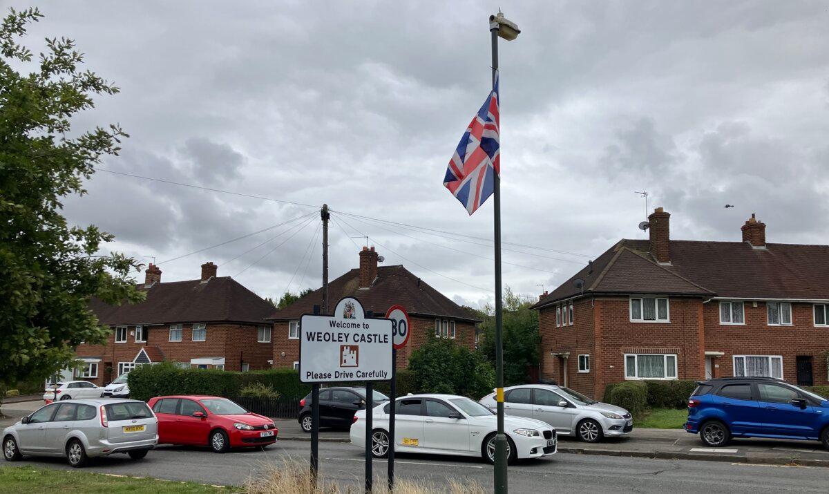 Flags fly in Weoley Castle, Birmingham, UK, on Sept. 2, 2025. (Guy Birchall/The Epoch Times)