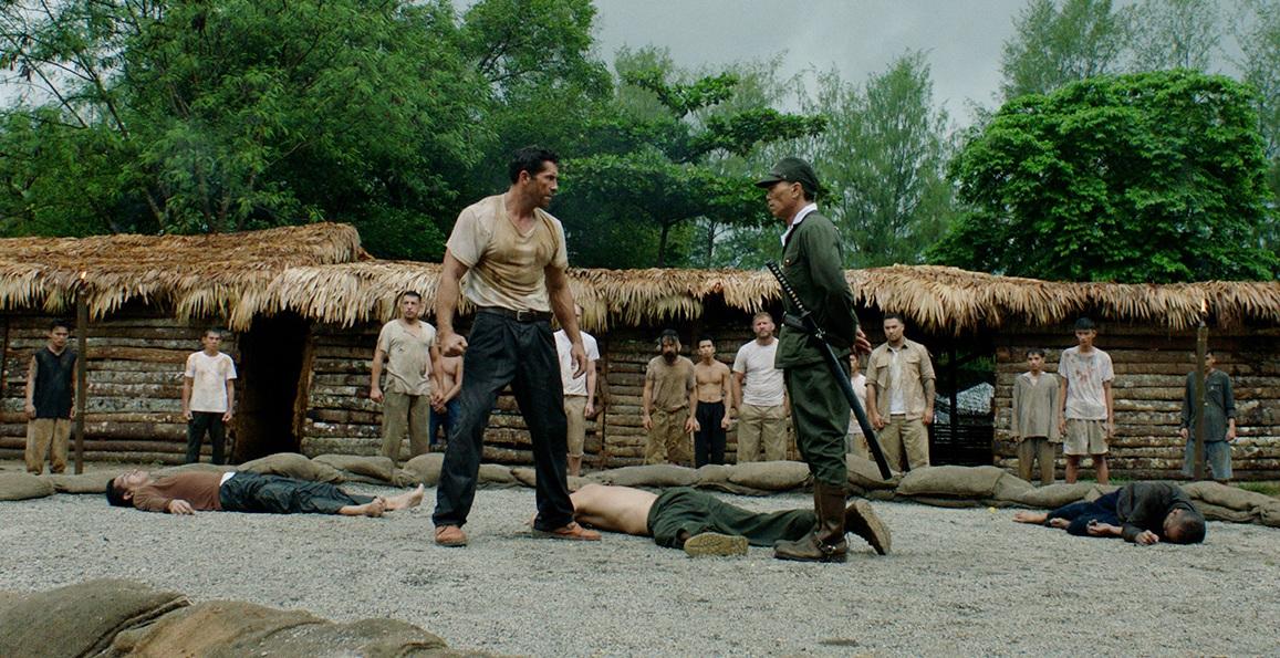 Amid fallen guards, Wing Cmdr. James Wright (Scott Adkins, L) faces Lt. Col. Ito (Peter Shinkoda), in "Prisoner of War." (Well Go USA)