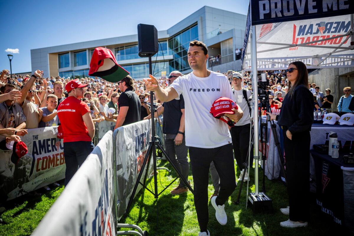 Charlie Kirk hands out hats before speaking at Utah Valley University in Orem, Utah, Sept. 10, 2025. He would later be fatally shot that same day. (Tess Crowley/The Deseret News via AP)