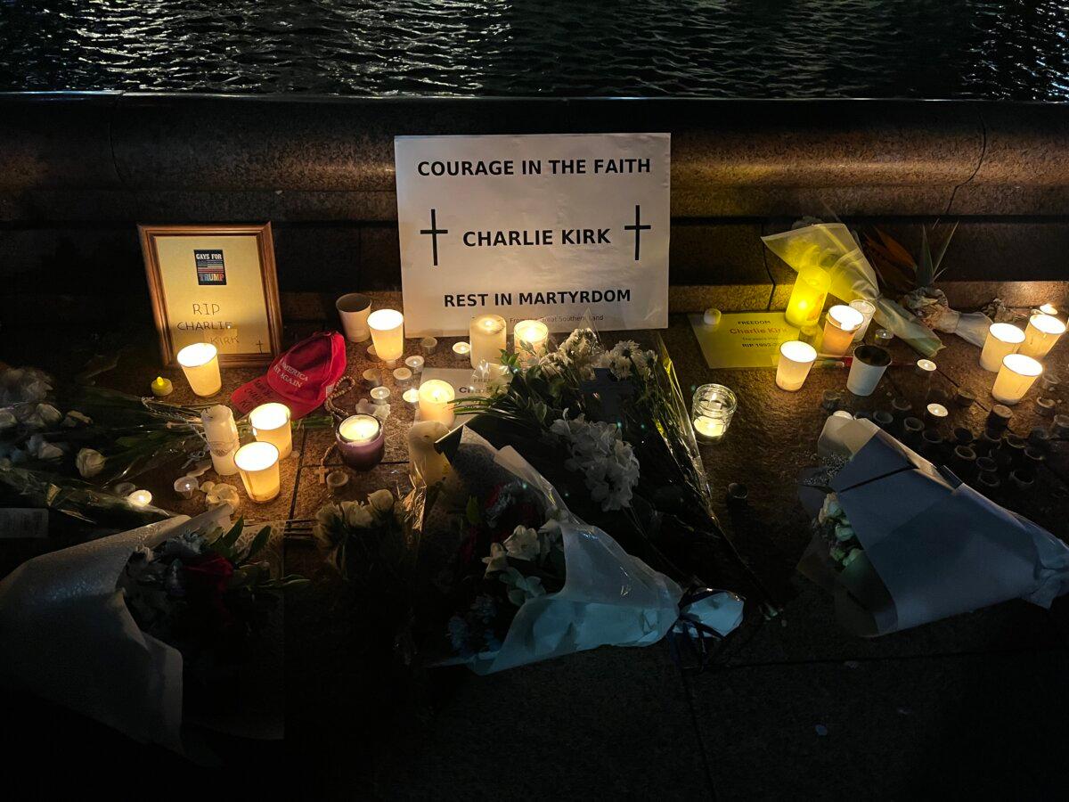 Local Australians put candles and memorial items at a vigil of Charlie Kirk in Sydney, Australia, on Sept. 12, 2025. (Cindy Li/The Epoch Times)