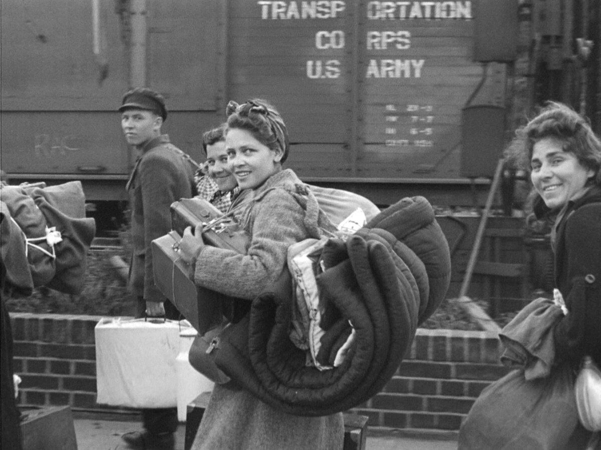 People on their way to board a train, in "Trains." (Bill Morrison)