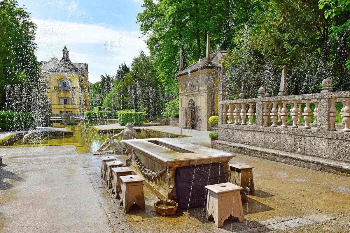 The Royal Table is one of Hellbrunn's fountain showpieces. Made of marble, the table has a deep groove in the center where spring water once chilled wine for the archbishop and his guests. On the archbishop’s signal, a lever was pressed to send water jets up from his guests’ stone stools. Due to strict court customs, guests weren’t allowed to stand up without permission, making this an amusing test of endurance. Hellbrunn notes that "the water is never felt as a torrent or a gush." (irisphoto1/Shutterstock)