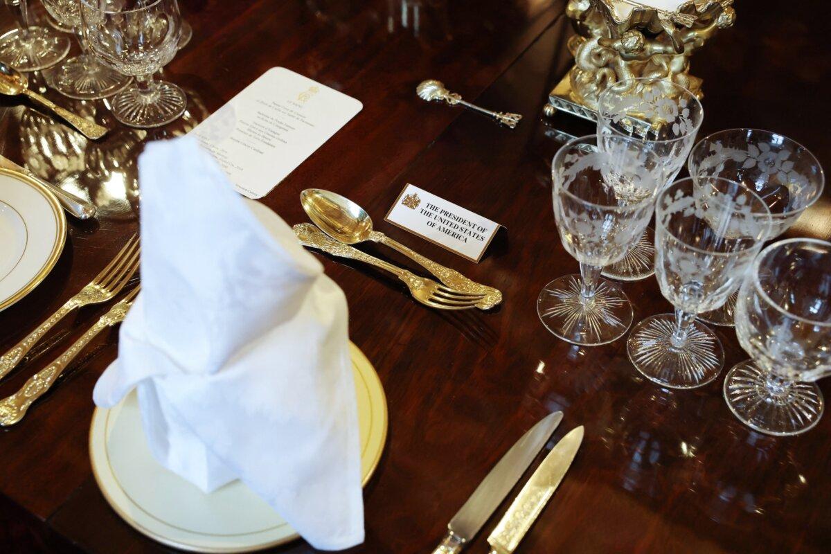 Place settings are pictured at the banquet table in St George's Hall, where U.S. President Donald Trump and his wife First Lady Melania Trump will attend a State Banquet during the U.S. president's second State Visit at Windsor Castle, in Windsor, on Sept. 17, 2025. (Anna Moneymaker/POOL/AFP via Getty Images)