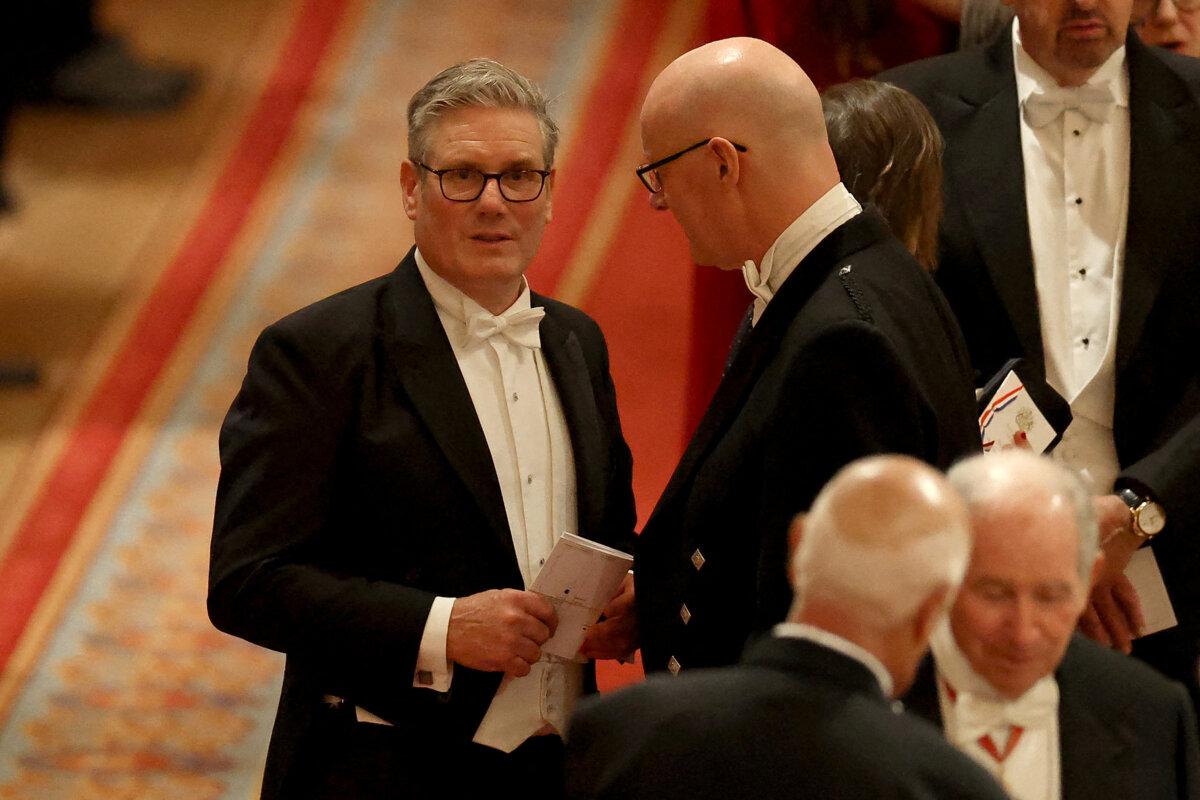 Britain's Prime Minister Keir Starmer (L) speaks to Scotland's First Minister John Swinney during a State Banquet during the U.S. president's second State Visit, at Windsor Castle, in Windsor, on Sept. 17, 2025. (Phil Noble/POOL/AFP via Getty Images)