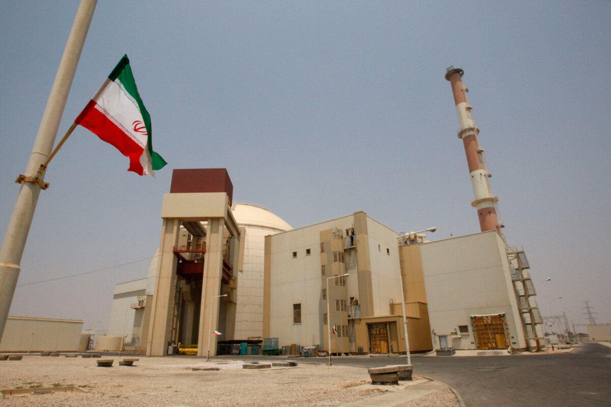 An Iranian flag flutters in front of the reactor building of the Bushehr nuclear power plant, just outside Bushehr, Iran, on Aug. 21, 2010. (Vahid Salemi/AP Photo)