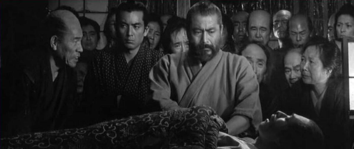 Dr. Noboru Yasumoto (Yuzo Kayama, 2nd L) and Dr. Kyojo “Redbeard” Niide (Toshiro Mifune, C) cares for those in need, in “Red Beard.” (Toho)