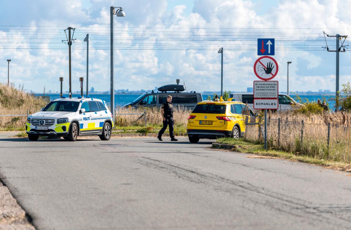 Danish police and the Danish Security and Intelligence Service (PET) are present at railway DSB on Kystvejen by Copenhagen Airport, on Sept. 23, 2025. (Steven Knap/Ritzau Scanpix via AP)