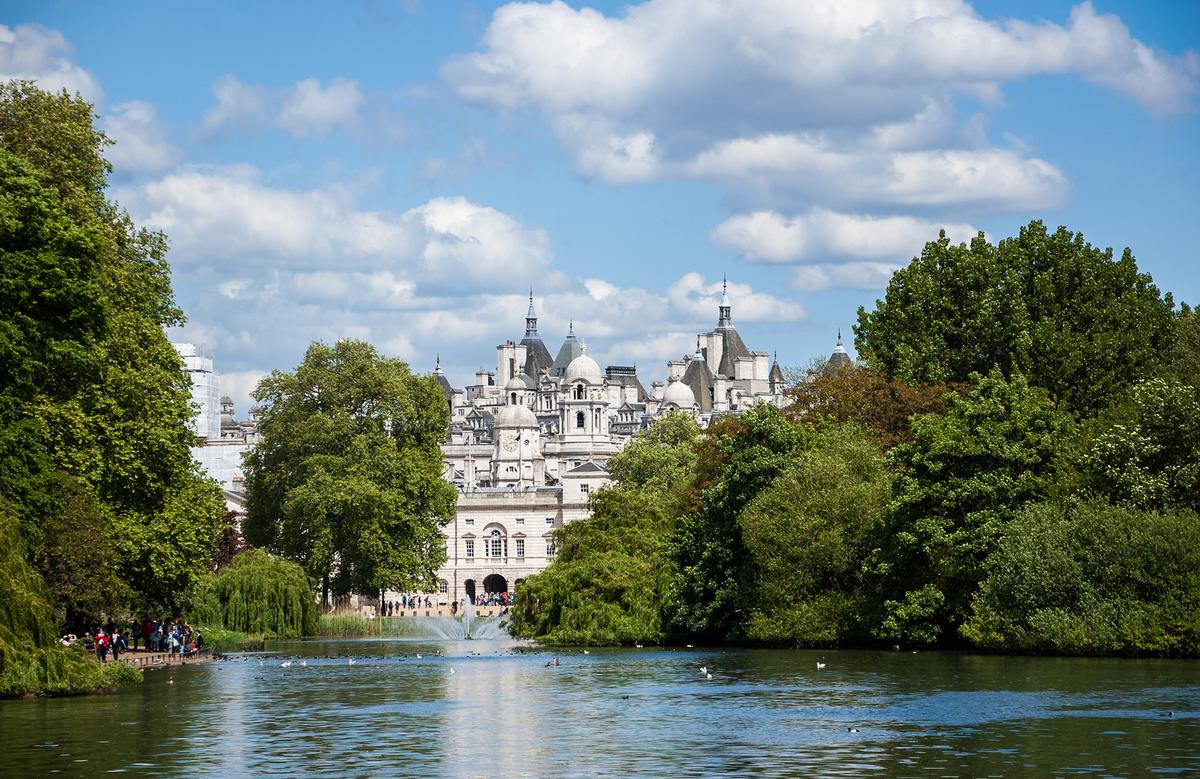 A peek of London across the Serpentine lake in Hyde Park reveals classical architecture and a lovely balance between human structures and the natural world. (Elena Dijour/Shutterstock)