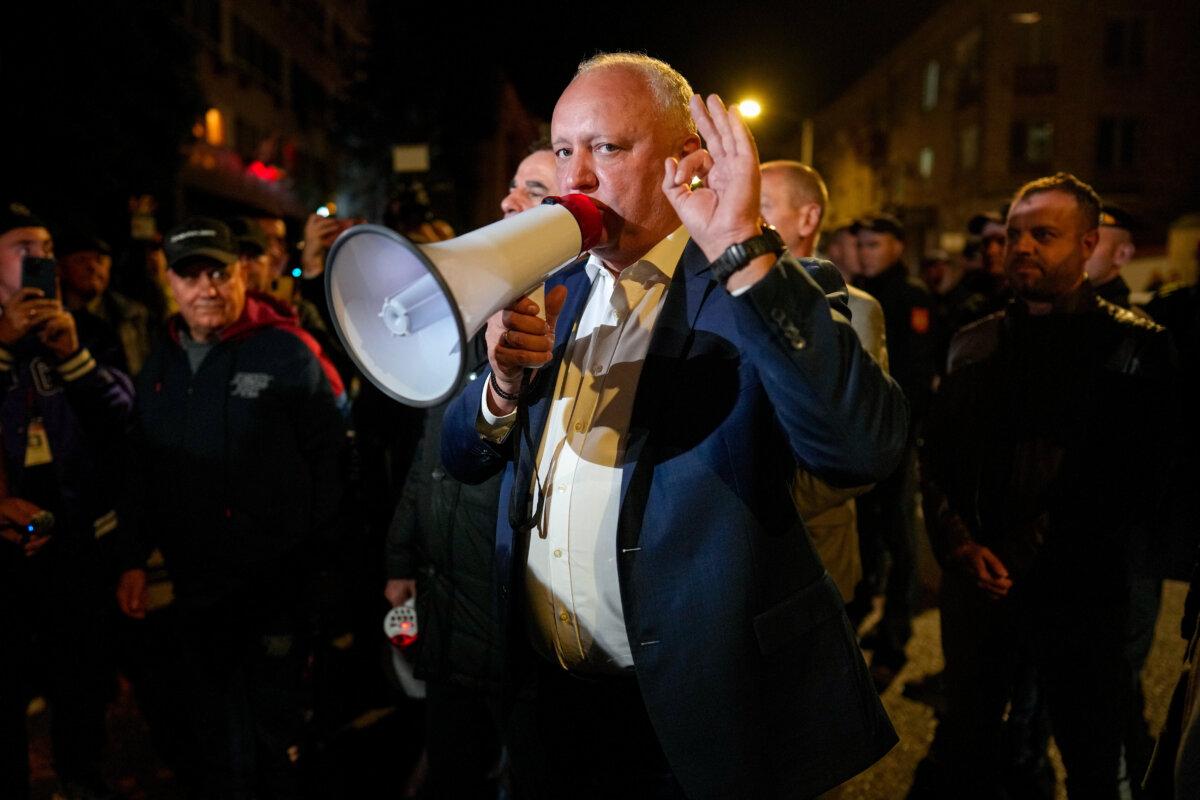 Former Moldovan President Igor Dodon, a member of the pro-Russian Patriotic Electoral Bloc, speaks to supporters protesting outside the Electoral Commission after the polls closed for the parliamentary election in Chisinau, Moldova, on Sept. 28, 2025. (Vadim Ghirda/AP)