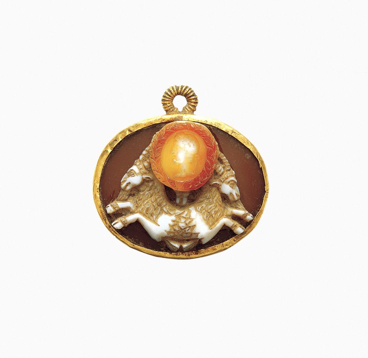 Sardonyx cameo of a double capricorn with a portrait of the emperor Augustus, circa 27 B.C.–A.D. 14, in Rome. Sardonyx, gold; 1 1/8 inches. The Metropolitan Museum of Art, New York City. (Public Domain)