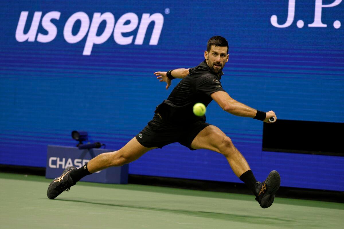Novak Djokovic, of Serbia, returns a shot against Taylor Fritz, of the United States, during the quarterfinal round of the U.S. Open tennis championships, Sept. 2, 2025, in New York. (Adam Hunger/AP Photo)