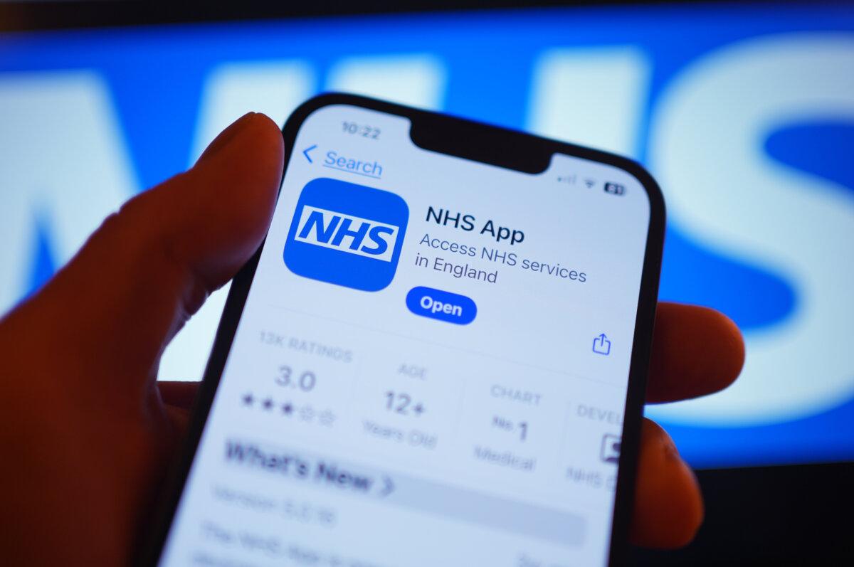 The NHS App on a mobile phone. (Yui Mok/PA)