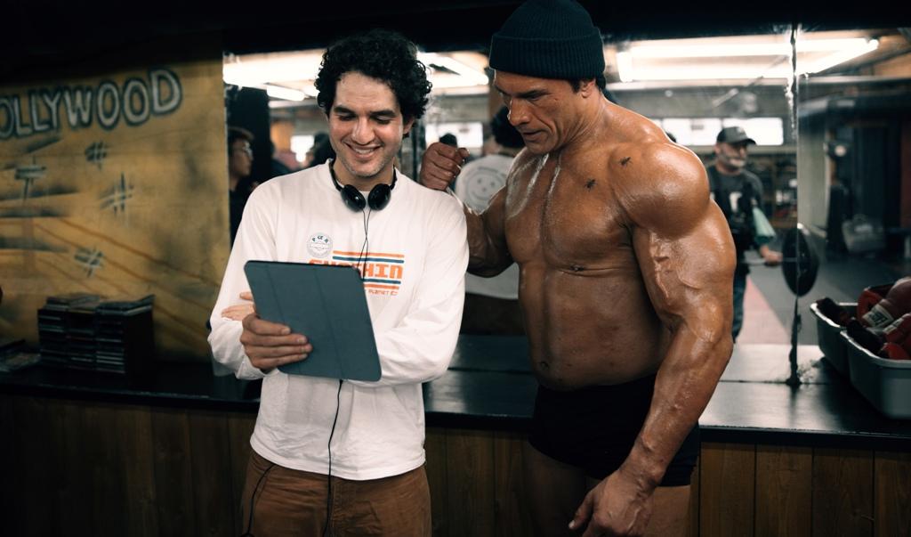 Director Benny Safdie (L) and Dwayne Johnson, on the set of "The Smashing Machine." (Eric Zachanowich/A 24)
