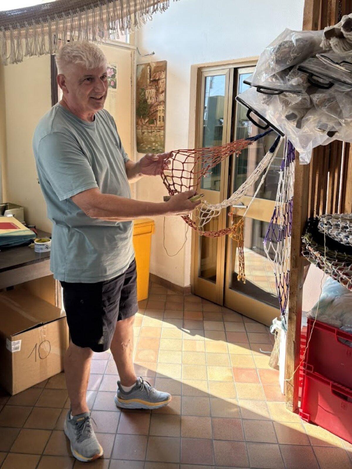 Paolo Archetti demonstrates making nets in Montisola, Italy. (Alison Ramsey)