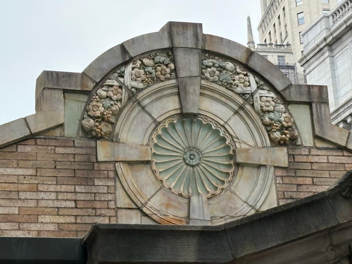 The masonry decorations at Bowling Green Station are full of detail and floral accents. (Deena Bouknight)