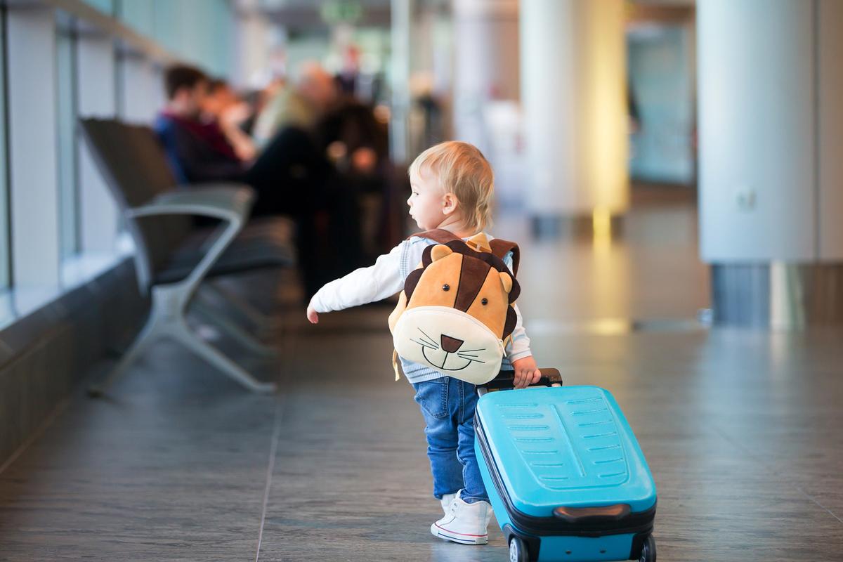 Flying with a toddler comes with challenges, but it also brings moments of wonder and shared excitement. (Tomsickova Tatyana/Shutterstock)