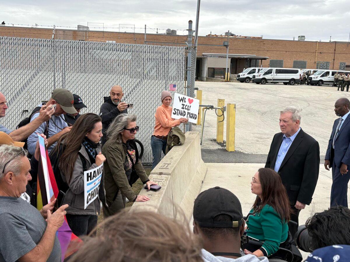 Sens. Dick Durbin and Tammy Duckworth (D-Ill.) speak to protesters outside of an Immigration and Customs Enforcement facility in Broadview, near Chicago, on Oct. 10, 2025. (Nathan Worcester/The Epoch Times)
