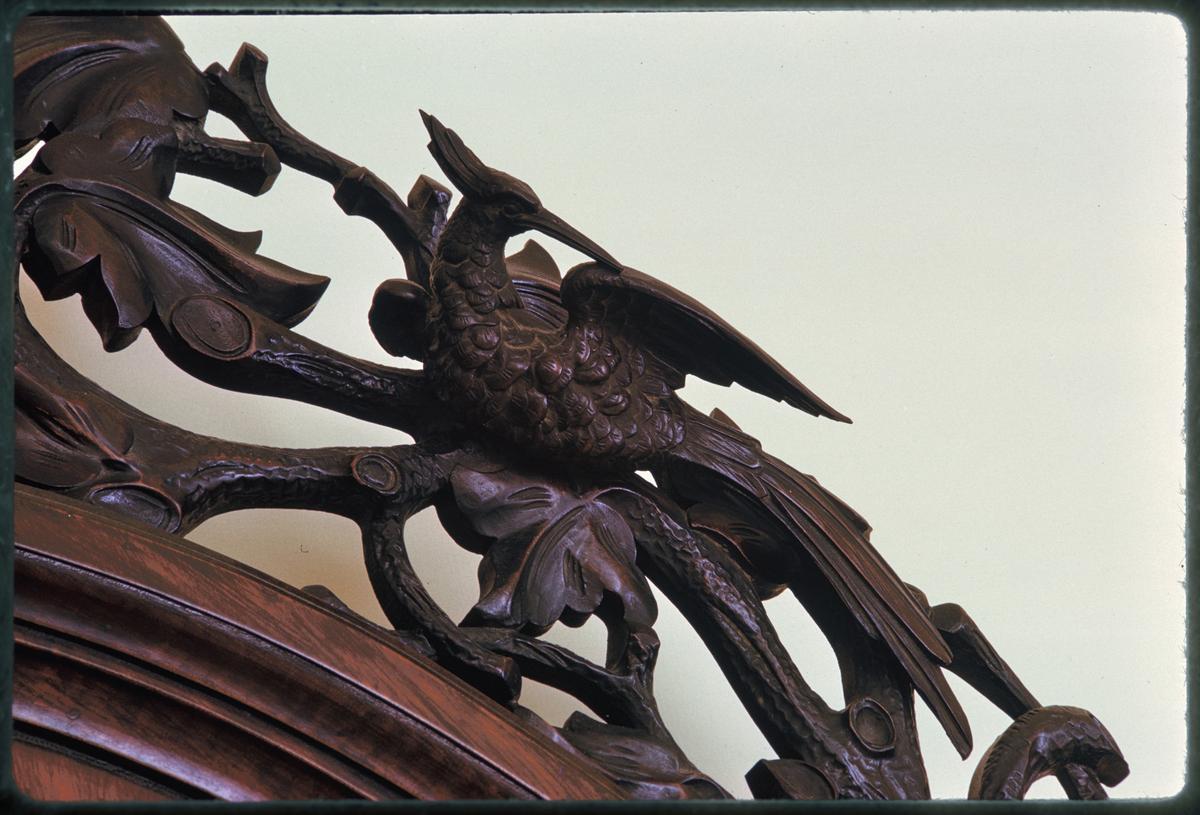 A detail of the ornately carved headboard featuring exotic birds and clusters of grapes. (White House Historical Association)