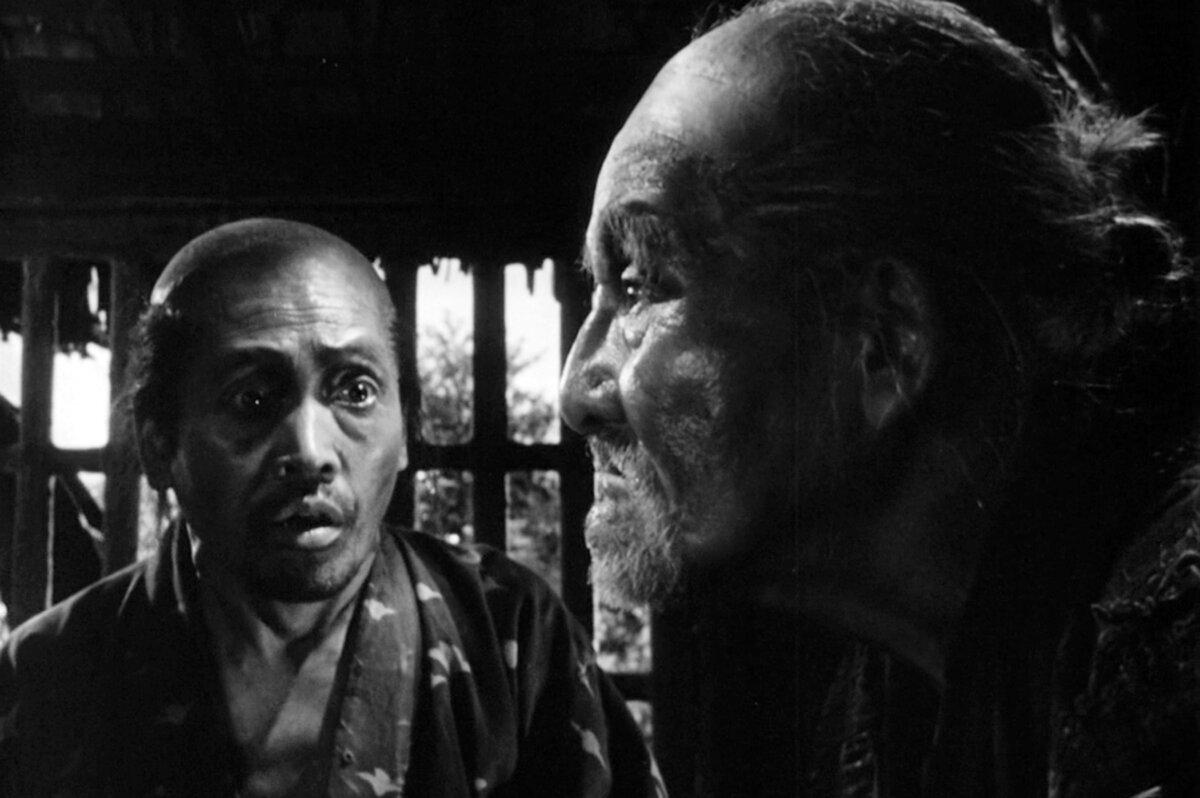 Gisaku (Kokuten Kodo, R) is the wise village elder, in “Seven Samurai.” (Toho)