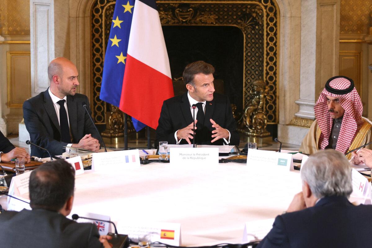 French President Emmanuel Macron, flanked by outgoing French Minister of Foreign Affairs Jean-Noël Barrot (L) and Saudi Arabian Foreign Minister Faisal bin Farhan Al-Saud, speaks during a meeting with European and Arab foreign ministers in Paris on Oct. 9, 2025. (Thomas Samson/Pool Photo via AP)