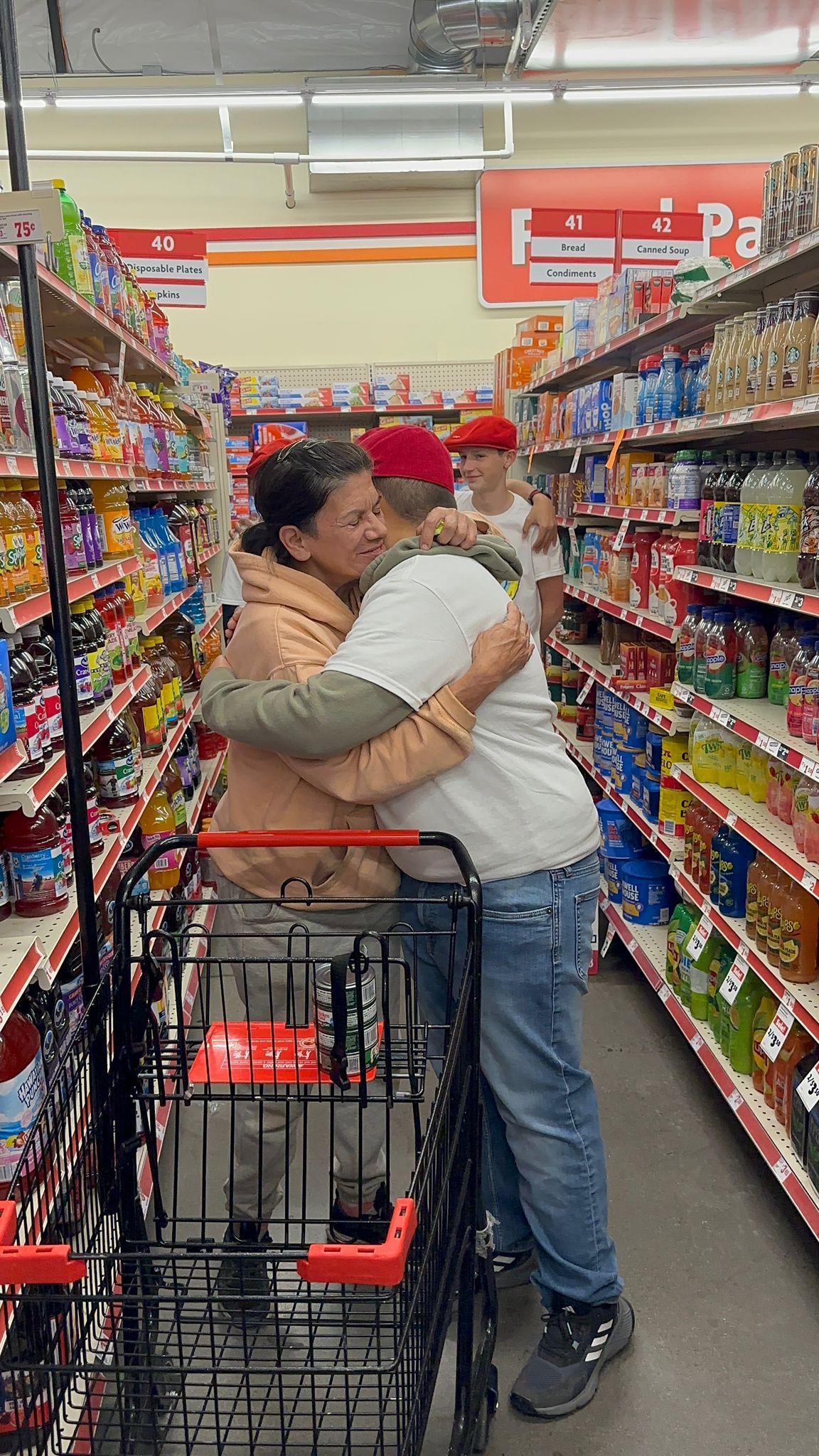 Francisco hugs a stranger during an Operation Secret Santa mission. (Courtesy of Derek Brown)