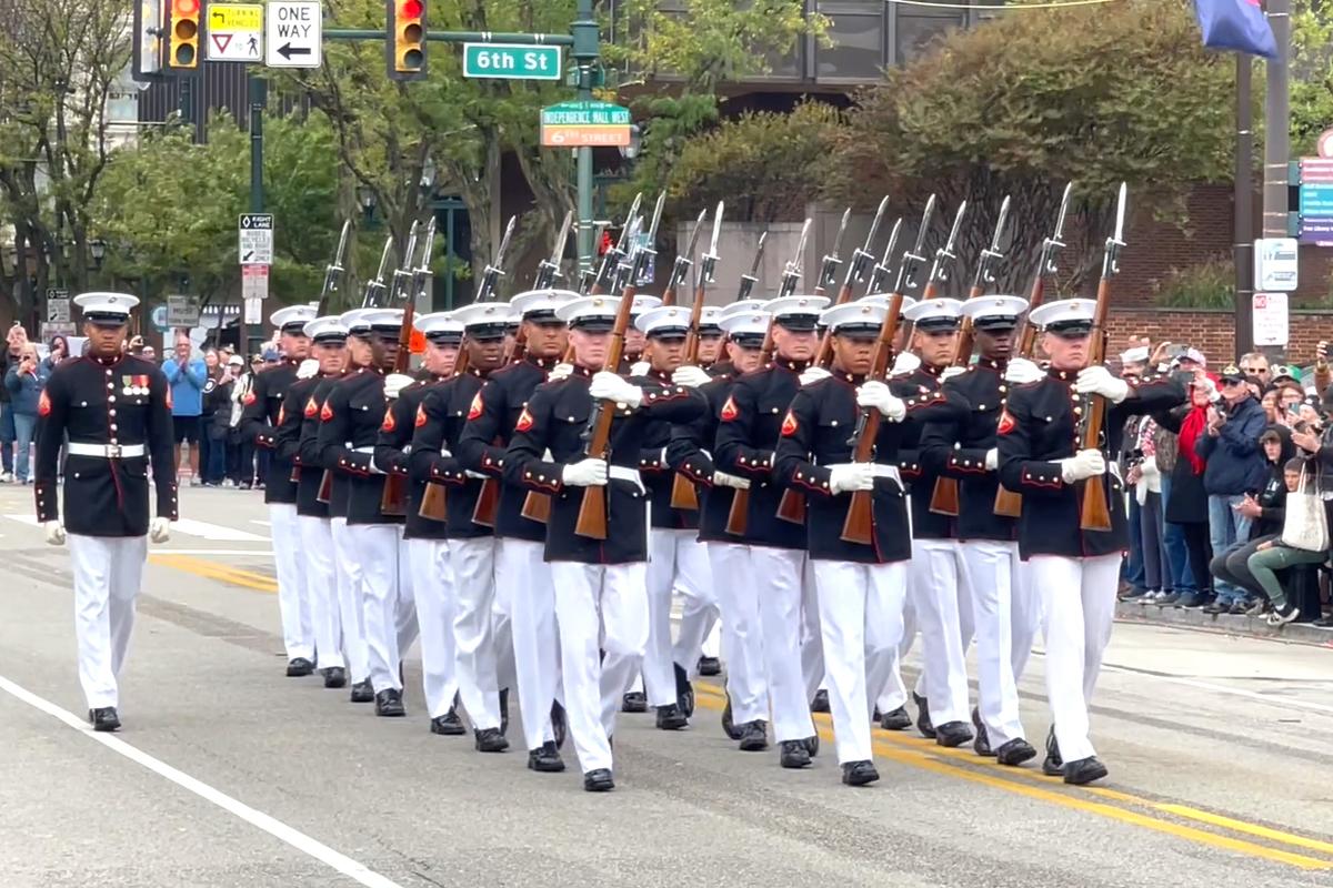 Thousands lined Market Street in Philadelphia for a grand parade, honoring the 250th anniversary of the U.S. Navy and Marine Corps, on Oct. 13, 2025. (Frank Liang/The Epoch Times)