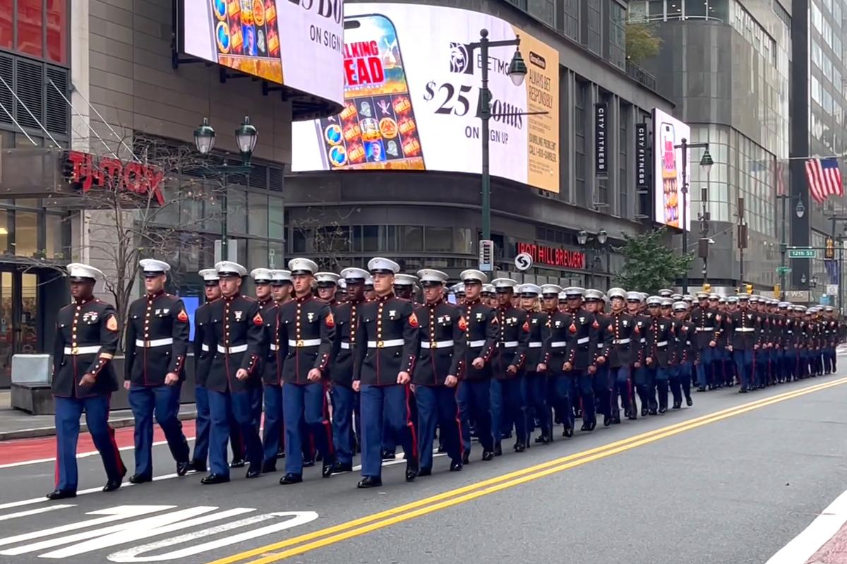 Thousands lined Market Street in Philadelphia for a grand parade, honoring the 250th anniversary of the U.S. Navy and Marine Corps, on Oct. 13, 2025. (Frank Liang/The Epoch Times)