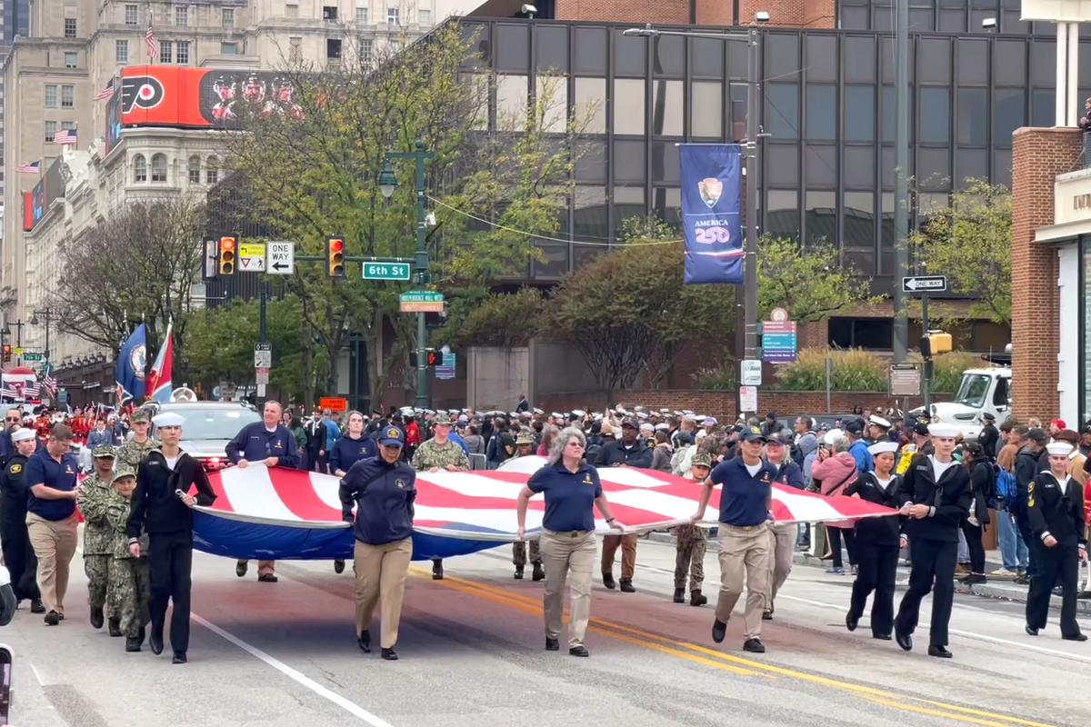 Thousands lined Market Street in Philadelphia for a grand parade, honoring the 250th anniversary of the U.S. Navy and Marine Corps, on Oct. 13, 2025. (Frank Liang/The Epoch Times)