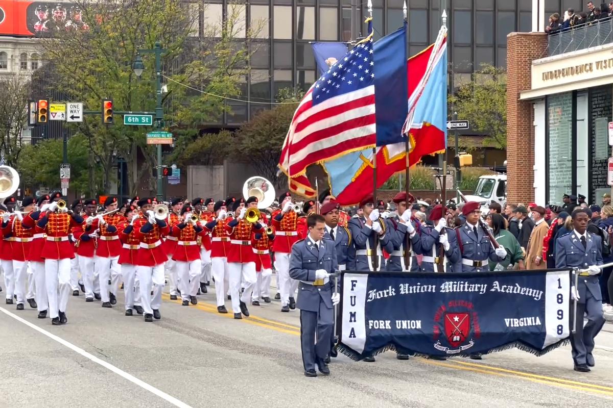 Thousands lined Market Street in Philadelphia for a grand parade, honoring the 250th anniversary of the U.S. Navy and Marine Corps, on Oct. 13, 2025. (Frank Liang/The Epoch Times)