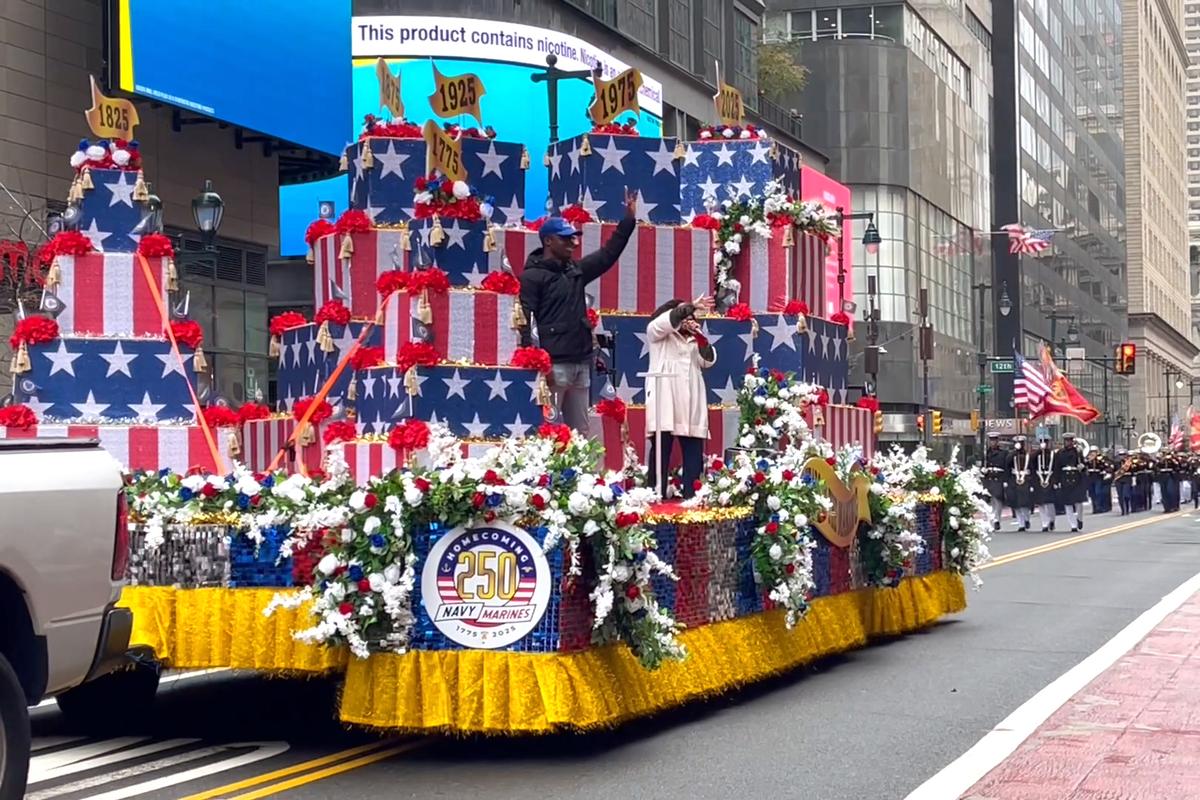 Thousands lined Market Street in Philadelphia for a grand parade, honoring the 250th anniversary of the U.S. Navy and Marine Corps, on Oct. 13, 2025. (Frank Liang/The Epoch Times)