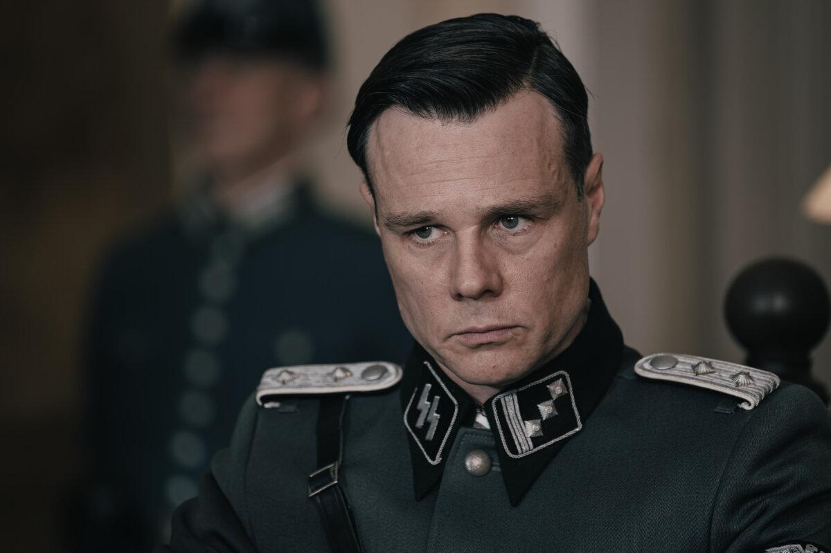 Erwin Mussener (Rupert Evans) doesn't understand that a young man could be writing pamphlets, in "Truth & Treason." (Angel Studios)