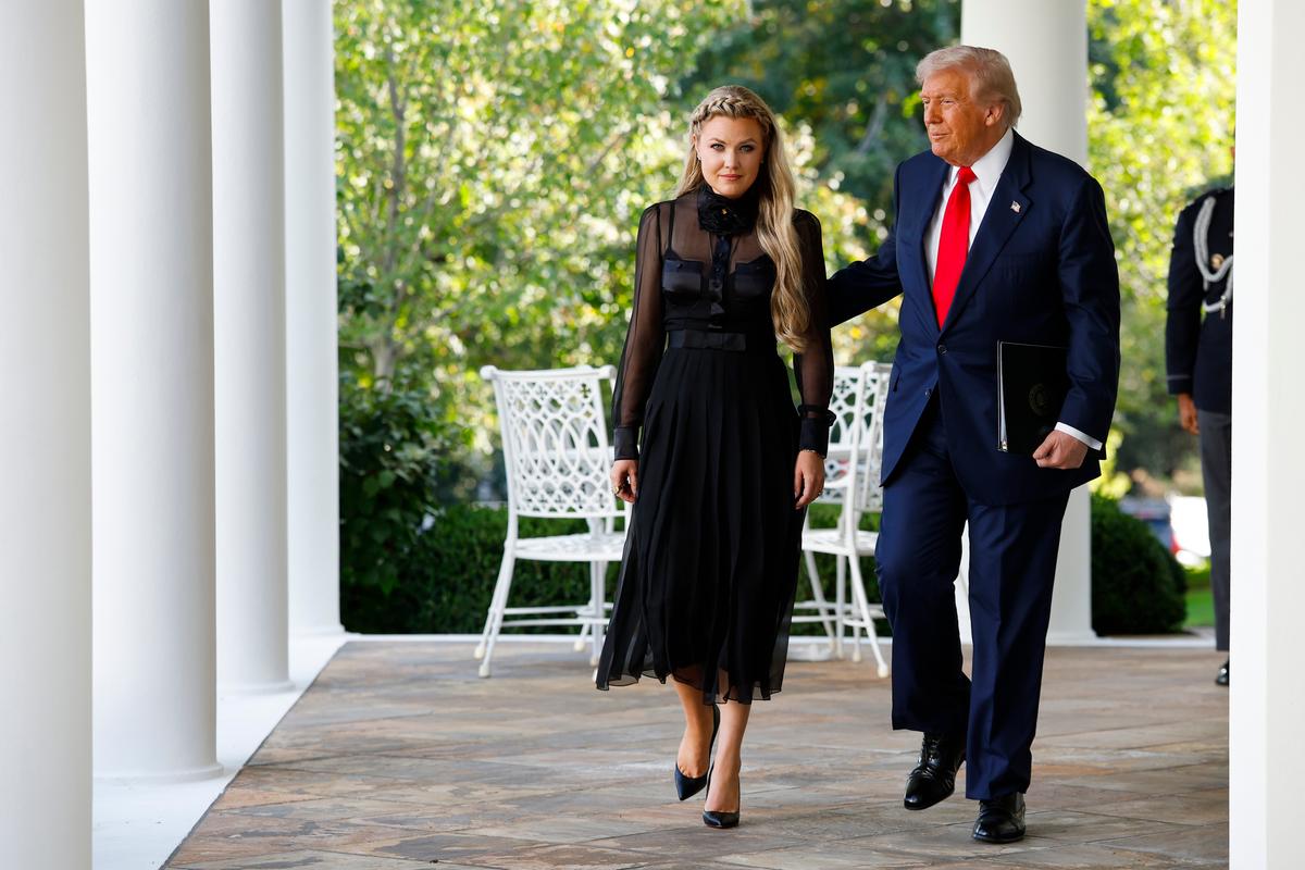 Erika Kirk (L), wife of late conservative commentator Charlie Kirk, arrives with President Donald Trump as he posthumously awards the Presidential Medal of Freedom to Charlie Kirk during a ceremony in the Rose Garden of the White House on Oct. 14, 2025. (Kevin Dietsch/Getty Images)