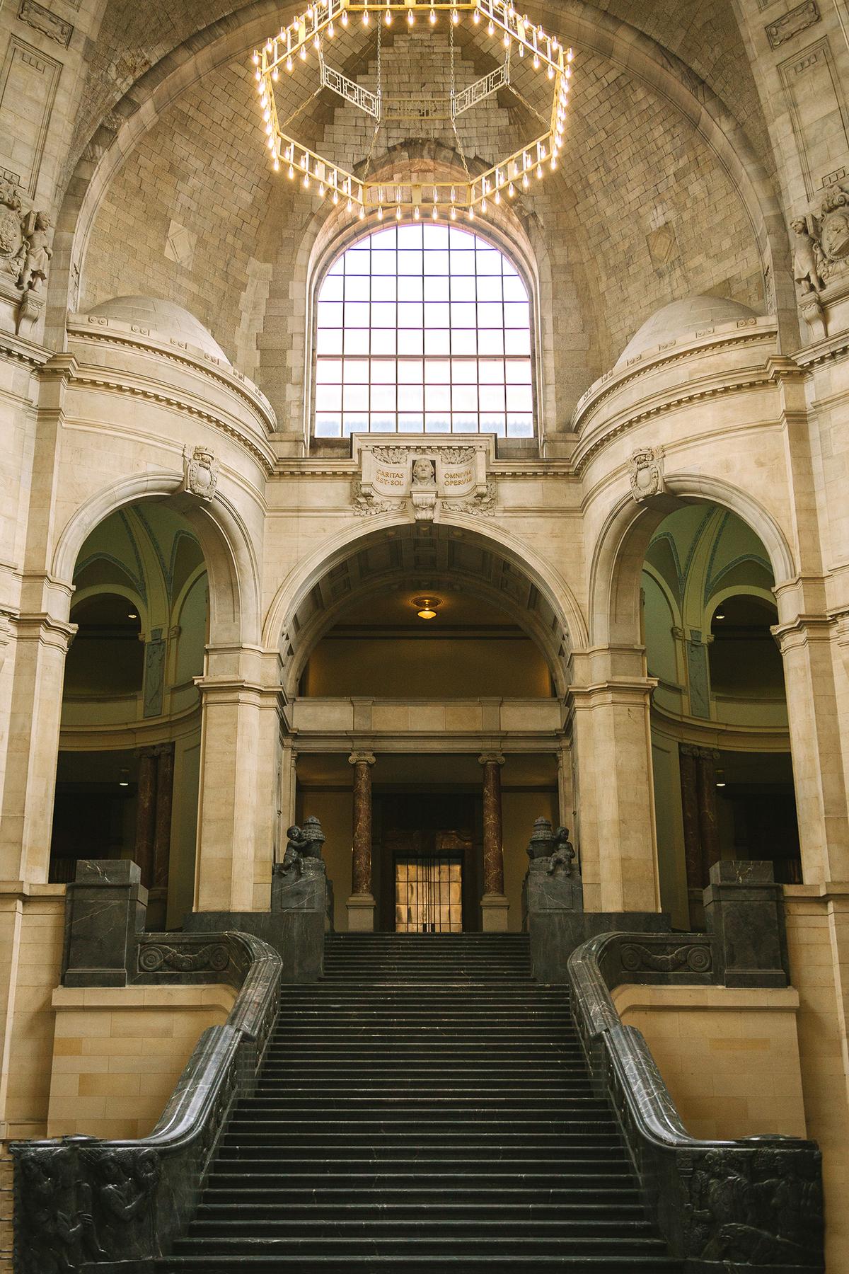 The grand marble staircase that leads from the hall to the upper floors was designed by Gustav Halmhuber in the Jugendstil style, the German counterpart to art nouveau. Jugendstil gradually became more geometric and included mythological and religious figures, as seen in the marble sculpted cherubs above the stairs' landing. (LightField Studios/Shuterstock)