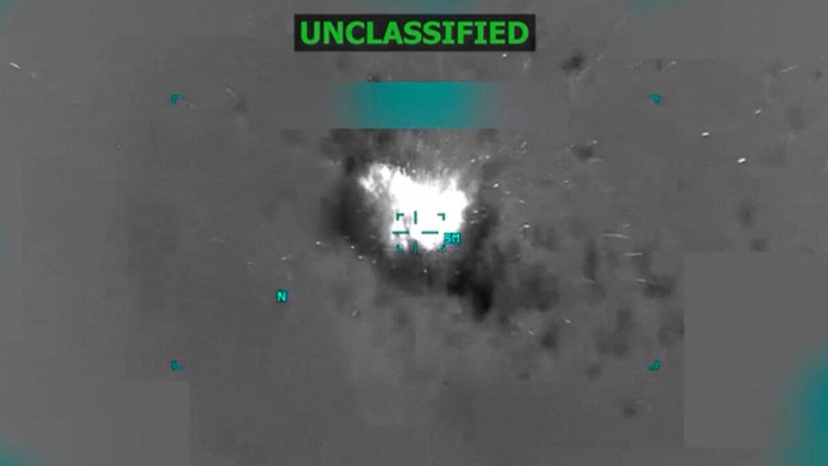 A boat burns off the coast of Venezuela in this screen grab taken from video footage released on Oct. 14, 2025, depicting what President Donald Trump said on a post on Truth Social was a U.S. strike on a drug-trafficking boat. (President Donald Trump via Truth Social via Reuters)