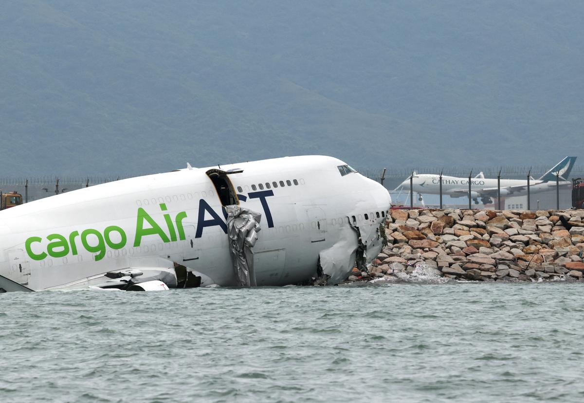 Cargo Aircraft Skids Off Hong Kong Runway Into Sea, Killing 2 Airport Workers