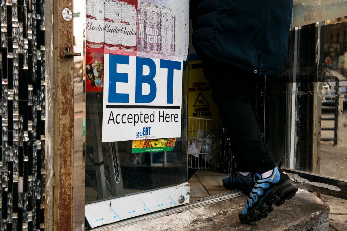 A sign alerting customers about SNAP benefits is displayed at a Brooklyn grocery store in New York City on Dec. 5, 2019. EBT stands for electronic benefit transfer. (Scott Heins/Getty Images)