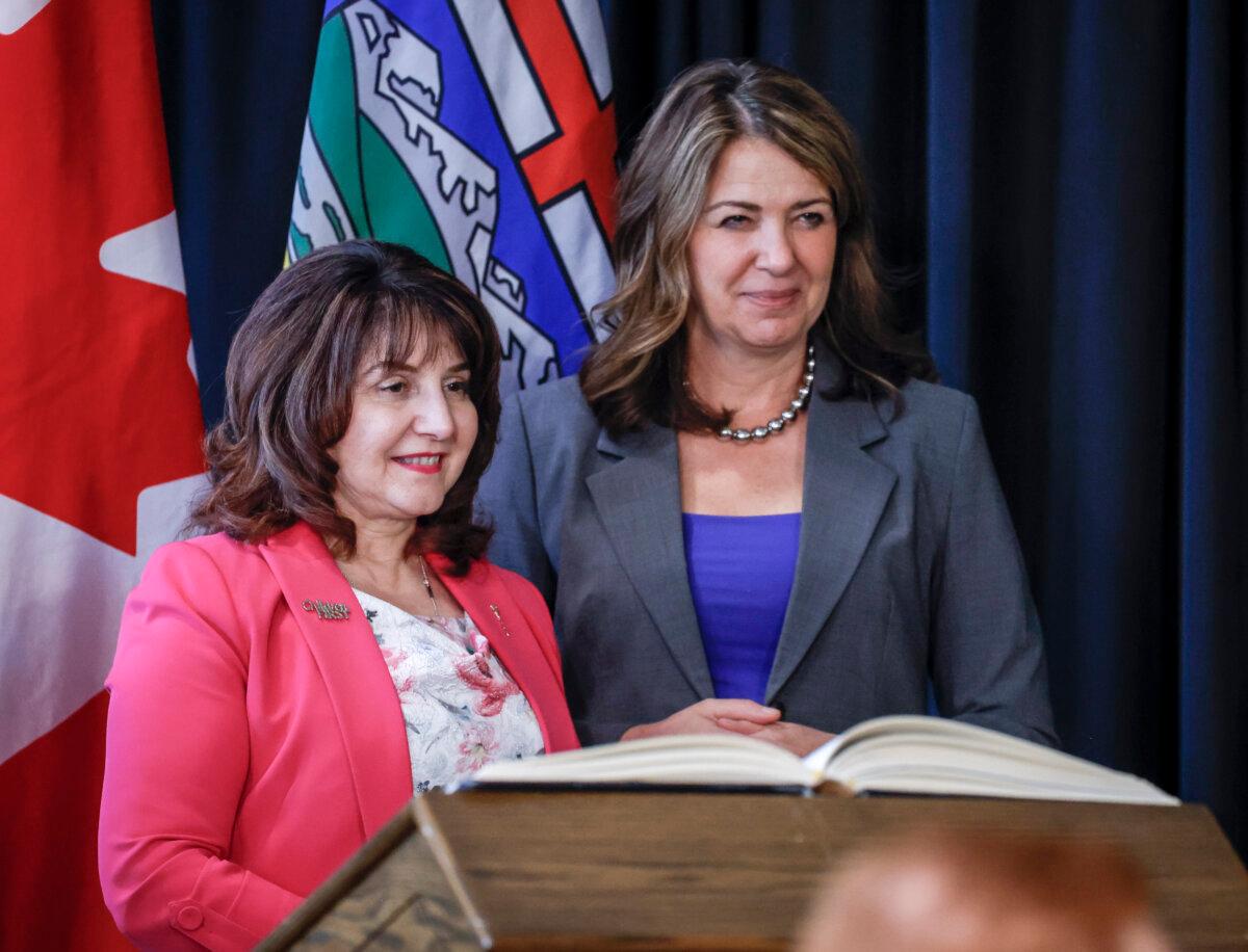 Alberta Premier Danielle Smith stands with Minister of Primary and Preventative Health Services Adriana LaGrange in Calgary on May 16, 2025. (The Canadian Press/Jeff McIntosh)