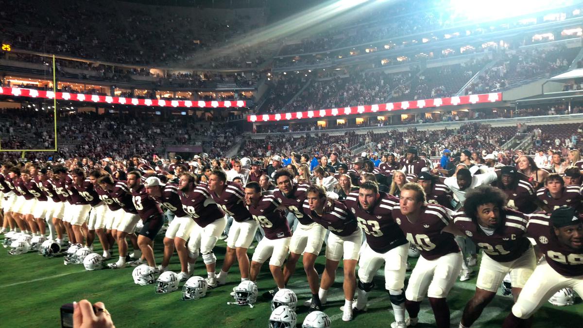 Players and spectators are immersed in the excitement of every play, drawn into the intensity of Aggie football. (Dustin Bass)