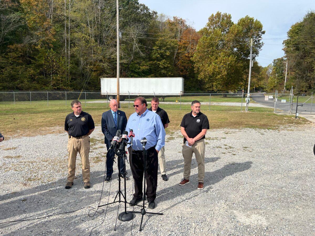 Officials from The Bureau of Alcohol, Tobacco, Firearms, and Explosives gather for a press conference outside an Accurate Energy Systems facility in Bucksnort, Tenn., on Oct. 24. (Jacki Thrapp / The Epoch Times)