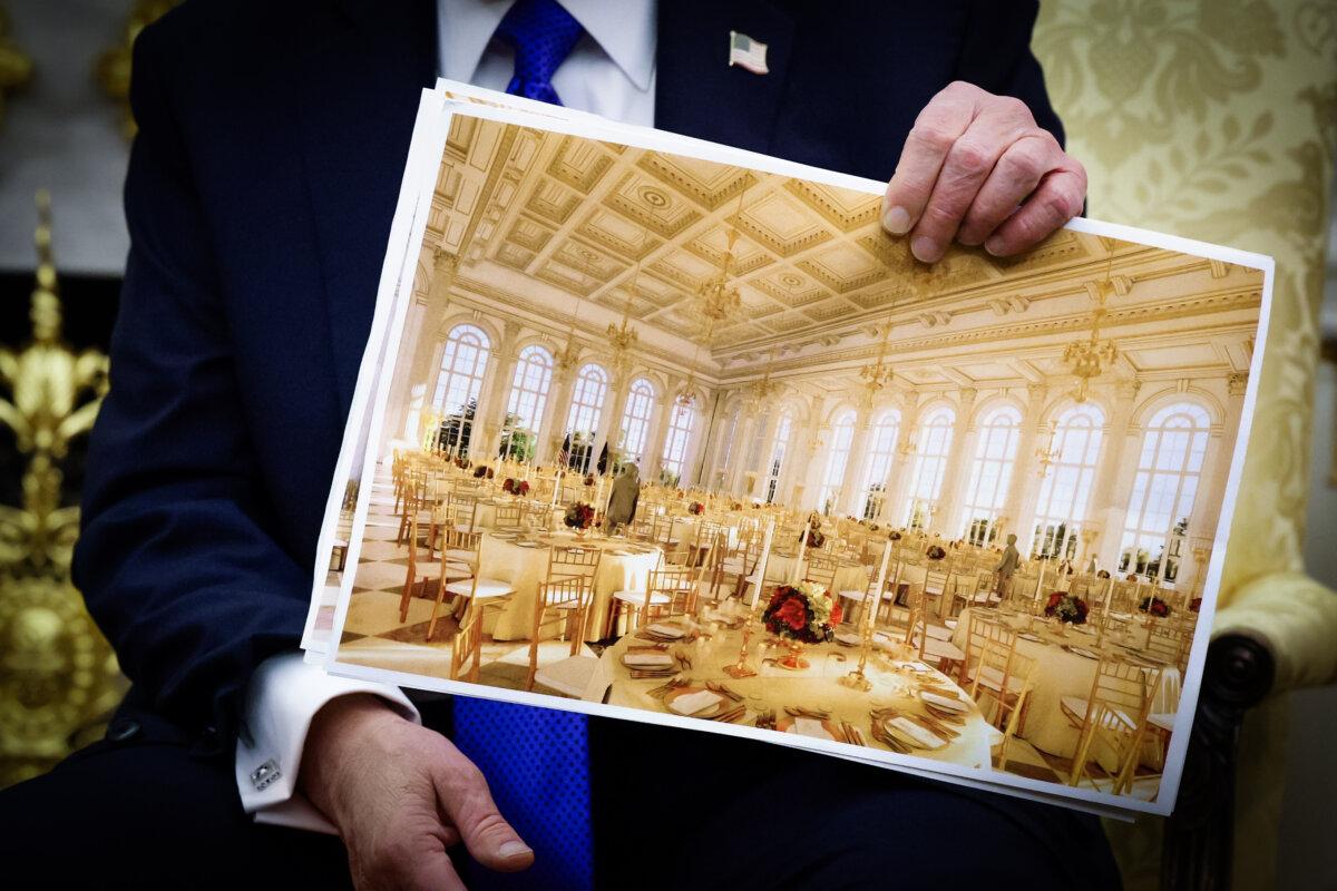 President Donald Trump displays a rendering of the proposed $300 million White House ballroom, to be funded by Trump and private donors, in the Oval Office on Oct. 22, 2025. (Alex Wong/Getty Images)