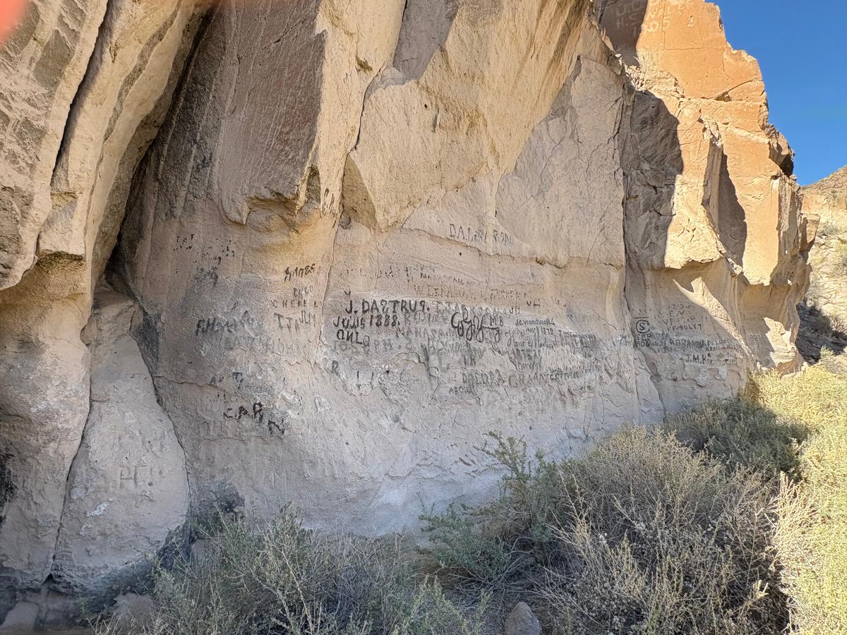Pioneers etched their names and the years they traveled, into the cliff, which is now aptly named "Pioneer Rock." (Deena Bouknight)