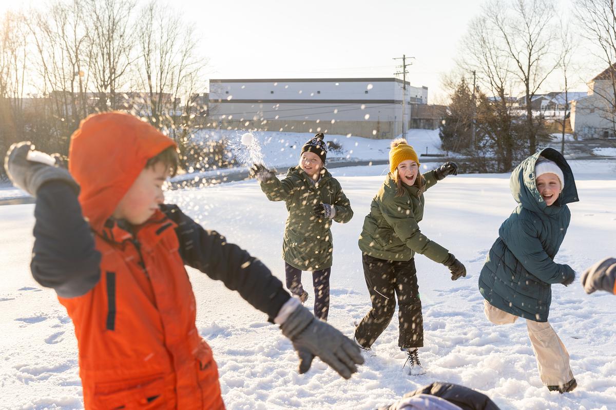 A snowball fight encourages movement, laughter, and friendly competition for the whole family. (Courtney Hale/Getty Images)