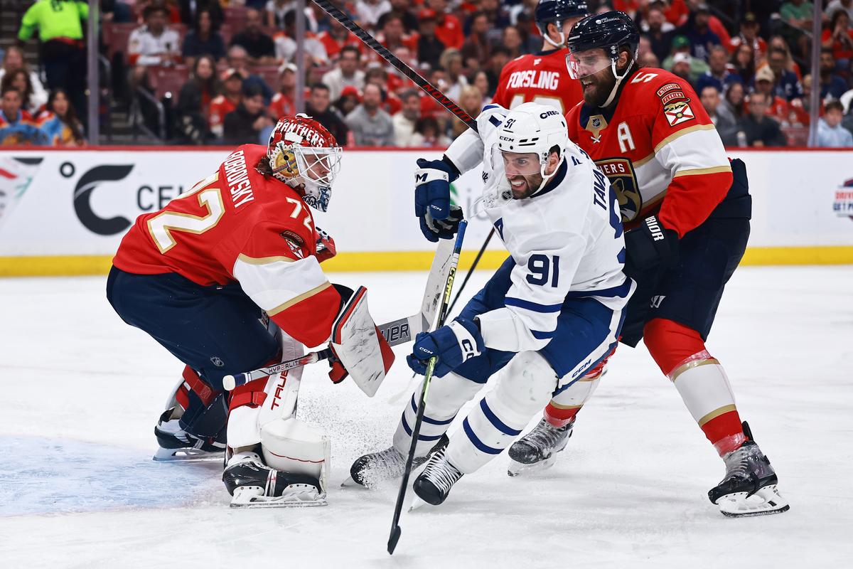 John Tavares, #91 of the Toronto Maple Leafs, skates against Aaron Ekblad, #5, and Sergei Bobrovsky, #72, of the Florida Panthers in game six of the second round of the 2025 Stanley Cup Playoffs at Amerant Bank Arena in Sunrise, Florida on May 16, 2025. (Carmen Mandato/Getty Images)