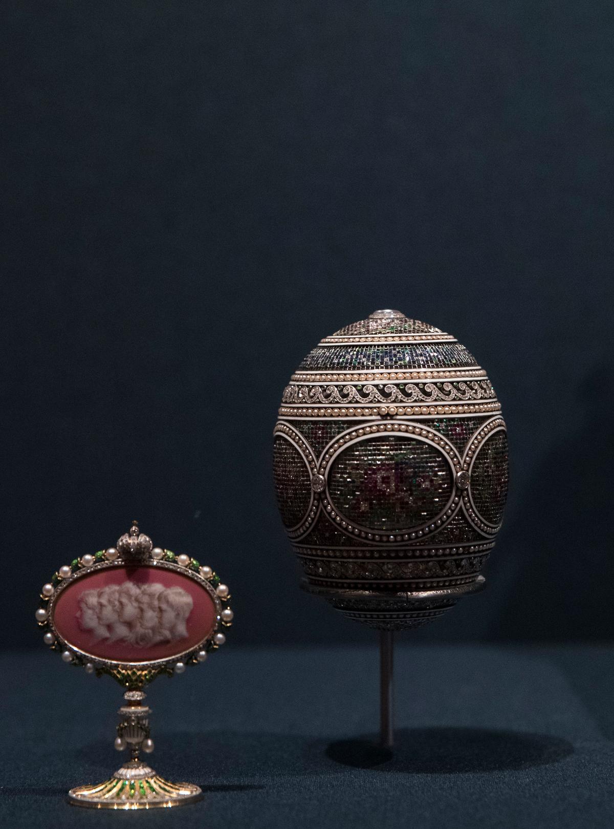 'The Mosaic Egg" and its surprise, which contains a portrait of Czar Nicholas II and Alexandra’s five children, on display at The Queen's Gallery in London. (John Phillips/Getty Images)