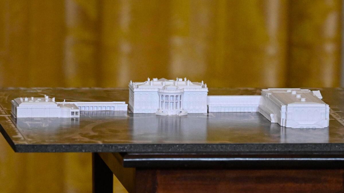 A model is seen as President Donald Trump addresses a dinner for donors who have contributed to build the new ballroom at the White House in Washington on Oct. 15, 2025. (John McDonnell/AP Photo)