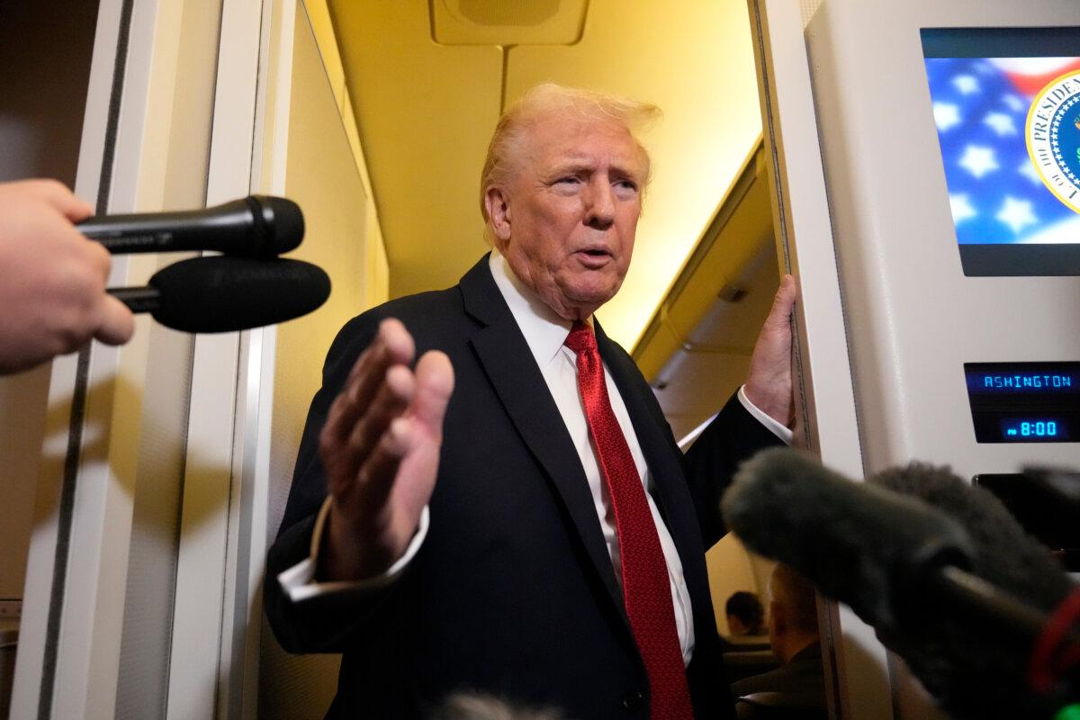 President Donald Trump speaks to reporters aboard Air Force One on Oct. 19, 2025. (AP Photo/Mark Schiefelbein)