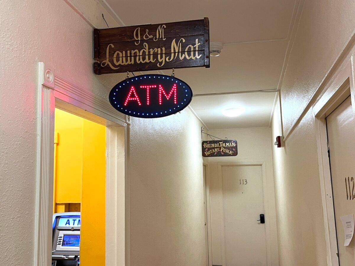 An ATM, a laundromat, and other services provide convenience for the residents of Begich Towers in Whittier, Alaska, on Nov. 4, 2025. (Allan Stein/The Epoch Times)