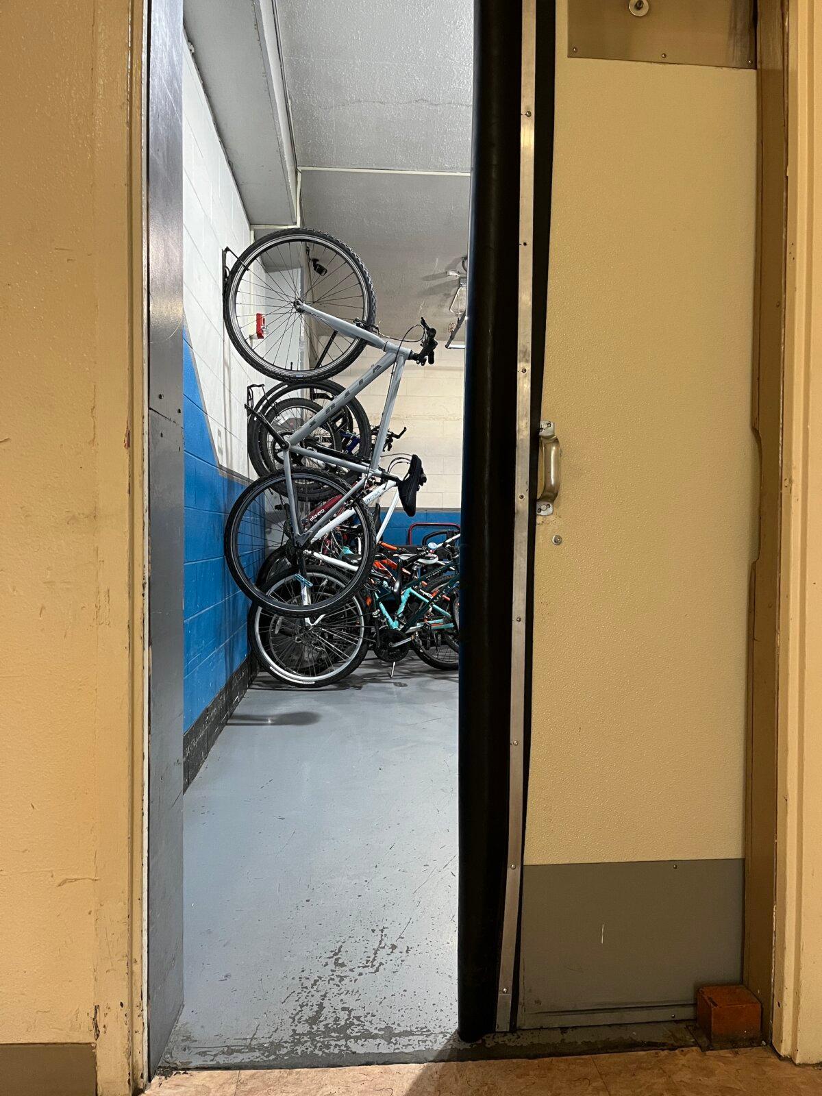 A rack filled with bicycles for residents who don't always need a car to get around Whittier, Alaska. Photo taken on Nov. 4, 2025. (Allan Stein/The Epoch Times)