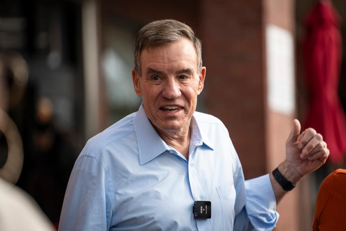 Sen. Mark Warner (D-Va.) speaks at a campaign event for Virginia Democratic gubernatorial candidate former Rep. Abigail Spanberger at H Mart in Centreville, Va., on Nov. 2, 2025. (Madalina Kilroy/The Epoch Times)
