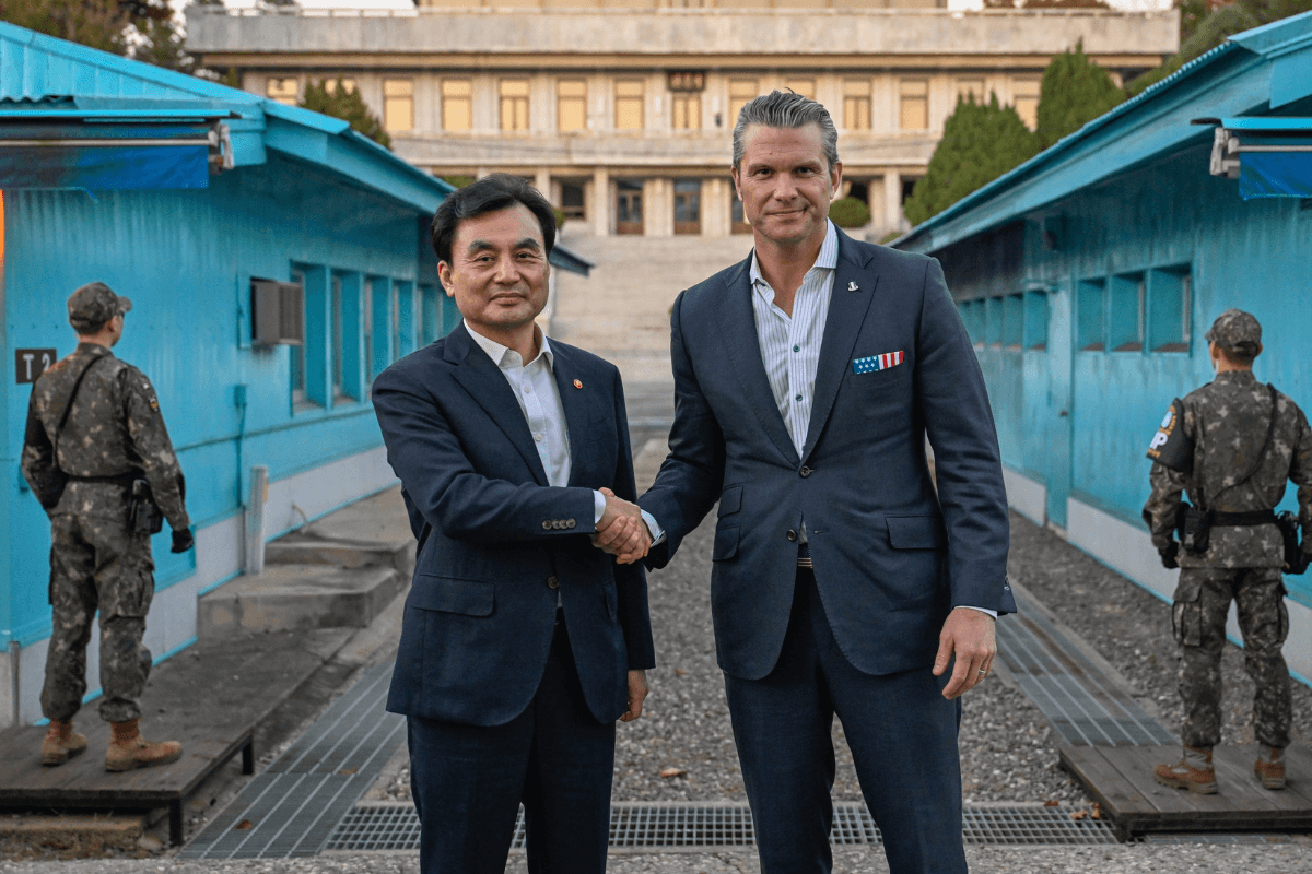U.S. Secretary of War Pete Hegseth (R) shakes hands with South Korean Defense Minister Ahn Gyu-back in the demilitarized zone, at the southern side of Panmunjom, South Korea, on Nov. 3, 2025. (South Korea Defense Ministry via AP)